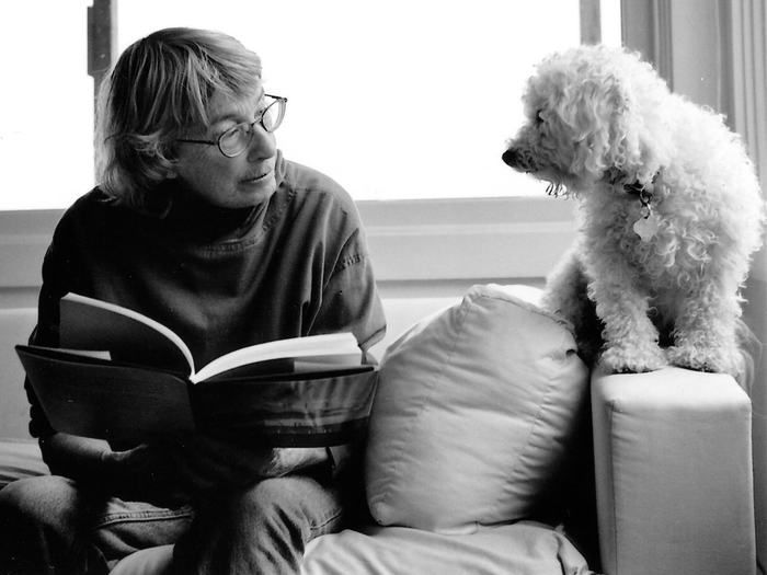 Mary Oliver reading next to dog
